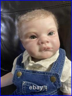 Reborn grant 23 inches with blonde hair and green eyes